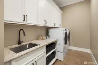 Main level mudroom off the garage.  Laundry room #2.