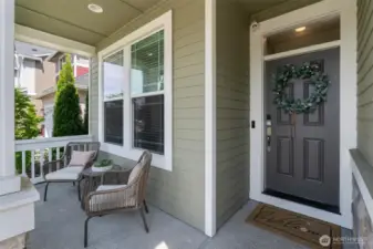 A charming covered front porch welcomes you home & keeps your packages dry!