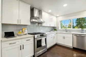 Spacious chefs' kitchen with 5 burner stainless steel range, dish washer and three drawer LG refrigerator, "mealtime made easiier"...
