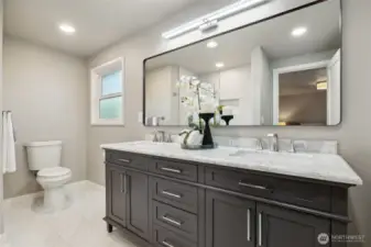 Primary bath features dual sink vanity set in a quartz countertop for easy cleaning and maintenance. Storage galore to satisfy the need for a place for everything...