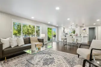 A Wall of windows lets in abundant light with a sliding door to the oversized east facing deck...