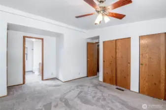 Primary bedroom with double closets and ensuite.