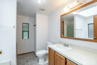 Primary ensuite with soaking tub and walk-in shower.