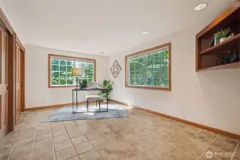 Main floor office/den - can be used as bedroom, thanks to lots of closets!  (Or flex room: yoga studio, playroom, media room, so many options!)