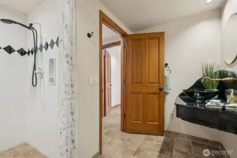 Main floor 3/4 bathroom with walk-in shower.