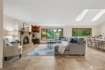 The expansive windows let the lake shine in! In the winter you'll appreciate the hydronic heated floors and the cozy gas fireplace.