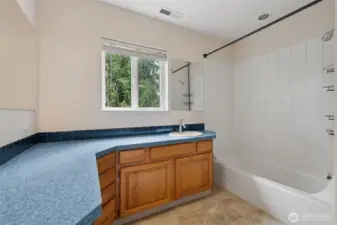 Upstairs full bathroom with generous counter space