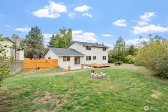 The back yard is surround by beautifully mature gardens, providing the perfect space for entertaining or for quiet solitude.