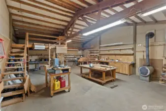 Shop with wood stove and work space.