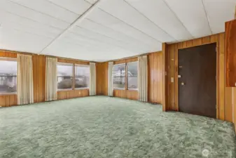 Here is the spacious living room w/lots of large windows!