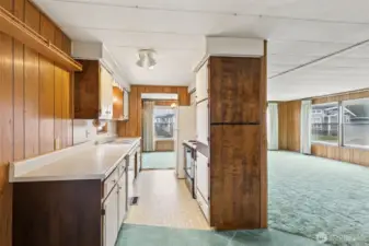 Kitchen w/partial view of the living room.
