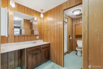 This is the bathroom in the primary bedroom. A walk in shower!