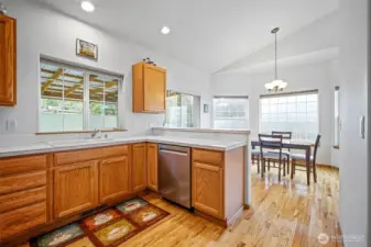 Open kitchen and dining area offers a convenient flow for everyday living and entertaining.