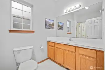 Primary bath with full size tub/shower combo.