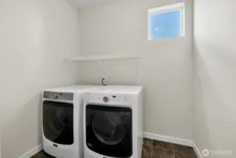 Large laundry room with natural light