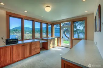This is the main floor bonus room, current owner used as office space. Nothing but natural light and large water views from this room!! Door accesses patio.