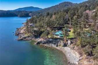 This photo shows the historical Lime Kiln located to the north of the main home, built on the bank above the beach. The property has ownership of a portion of this beach.