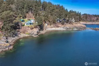 This photo shows the entire waterfront of the two parcels offered for sale. Neighbor's house to the right of this frame owns a portion of the beach in front.
