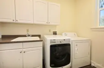 Generous laundry room with more storage.