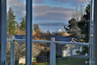 Views of the mountains and ferry from your primary suite deck.