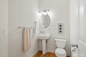 Main-level Powder Bath with a pedestal sink.