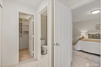 Primary suite includes a walk-in closet with closet system.