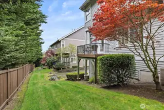 Nice deck with green views and the lawn is maintained by the HOA!