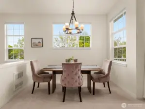 Dining area next to balcony and living room