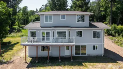 Back side of the 3 story home, all the windows have incredible water & mountain views.