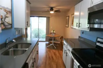 Galley kitchen and dining space beyond