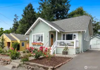 Welcome to 4106 SW Kenyon St - a charming Craftsman home with a covered front porch!
