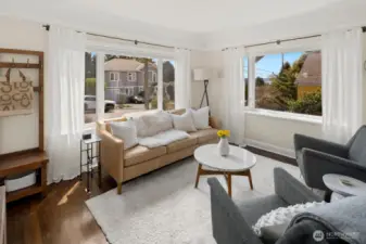 As you enter the home you walk into the living room with several large windows.
