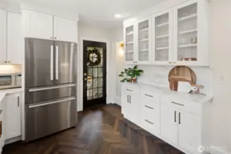 The built-in China cabinet is a great feature that maximizes the storage space in this kitchen!