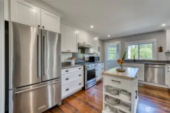 All the appliances are new and the door on the left goes to a mud room.