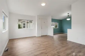 Main entry, living room, adjoining room could be used as a dining room, or an additional seating area