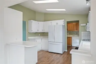 Just off the kitchen is the laundry room and access to the garage