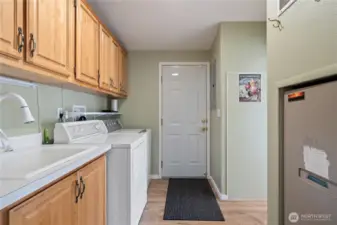 Door to garage is through the laundry area, hallway to the kitchen is on the right