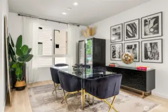 Dining space with natural light, flows to kitchen. Powder room and pantry off side.