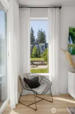 Corner windows with community views, natural light, quiet location.