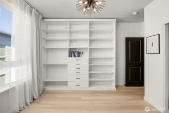 3rd floor guest room includes custom, built in shelving, central AC, and en-suite bath