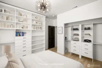 Virtually staged 3rd floor bedroom, shows Queen bed comfortably fitting in layout with wall shelving.
