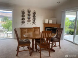 Fireplace in room off kitchen