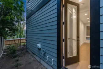 Door from 1st floor bedroom leads to the side/front yard.