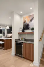 Wet bar with beverage refrigerator.