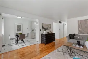 From the living room, glide over to the open dining space with ceramic tiled flooring accenting the dining room and kitchen. The easy flow circular floor-plan offers open sight lines between the two living spaces.