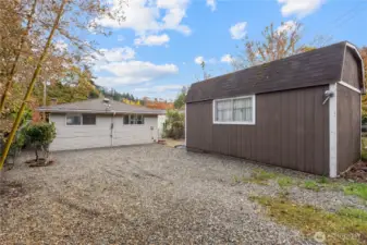 Conveniently park multiple cars in this large gravel parking pad.