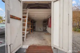 The two-tier large storage shed with power is perfect to store all your toys and tools.