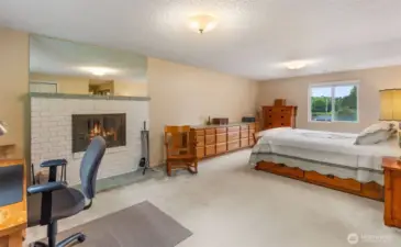 On the upper level the primary suite is spacious