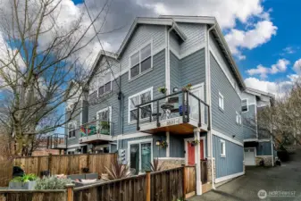 Great end unit craftsman style townhome. West facing fenced patio with gated entry to the front door.