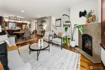 Living room has windows to the south and west for great natural light. Cozy gas fireplace anchors the space.